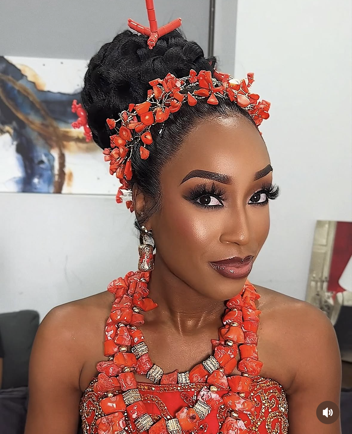 Traditional coral headpiece with braided updo