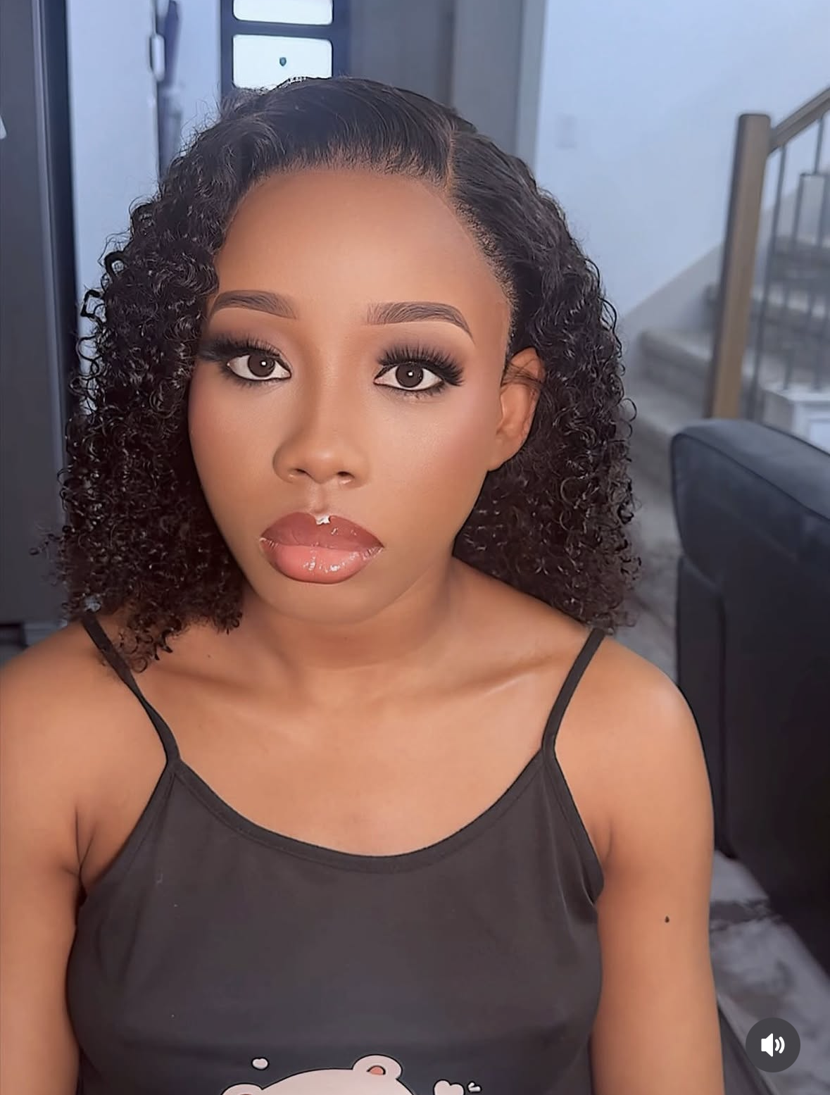 Curly bob wig styling with glossy nude lip