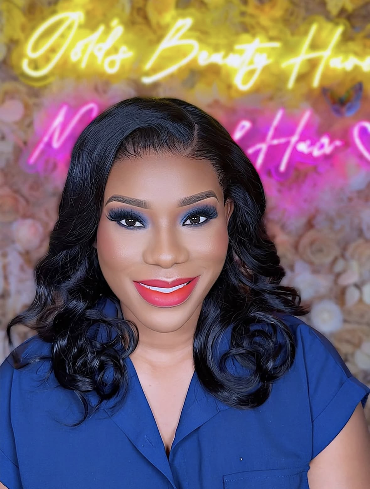 Glam makeup with blue eyeshadow and wavy hair