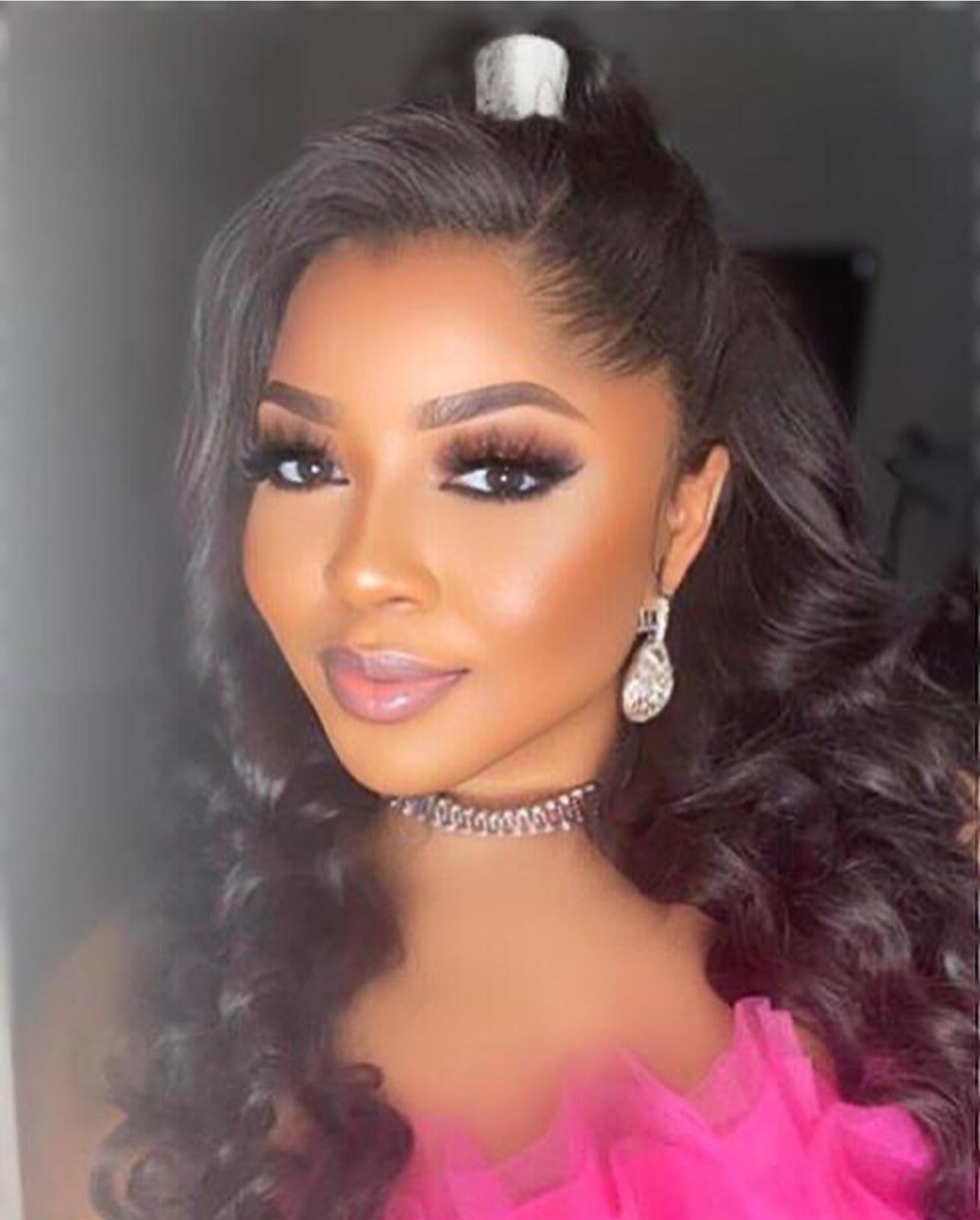 Ola, Houston makeup artist and master braider at Gold's Beauty Haven