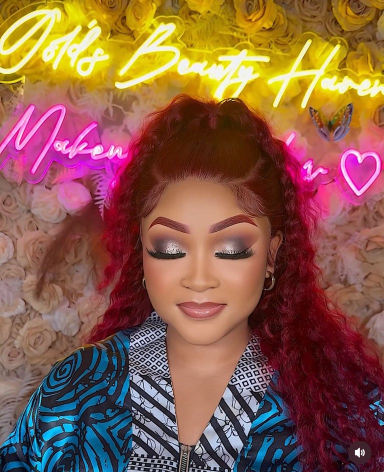 Editorial-style glam makeup with bold styled hair