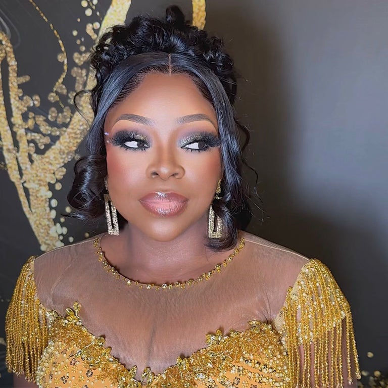 Dramatic evening glam with glitter smoky eye and gold sequin dress